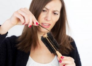 woman loosing hair