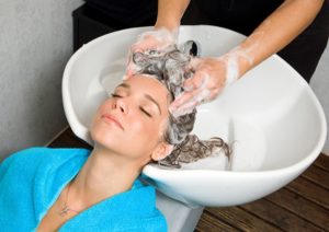woman washing hair in salon pool